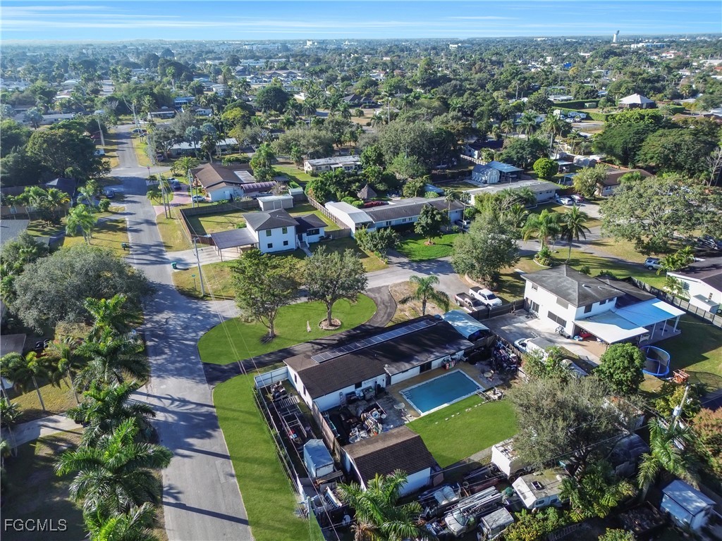 17255 Southwest 299th Street Homestead, FL 33030 - Photo 44 of 47 an aerial view of residential houses with outdoor space and trees