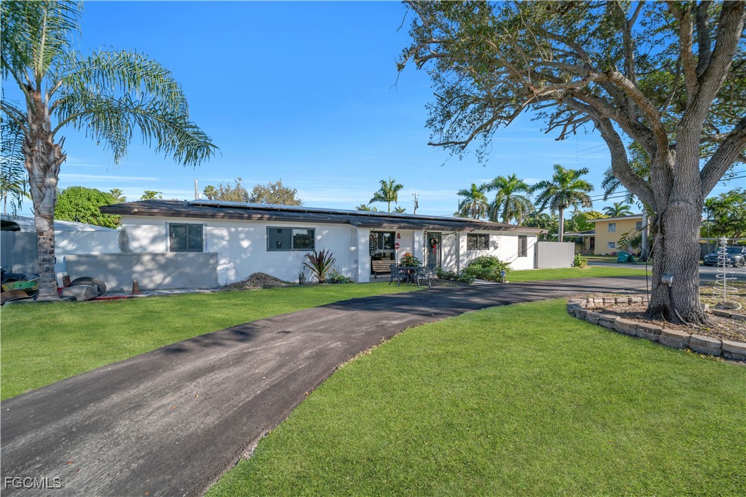 17255 Southwest 299th Street Homestead, FL 33030 - Photo 5 of 47 front view of a house with a yard