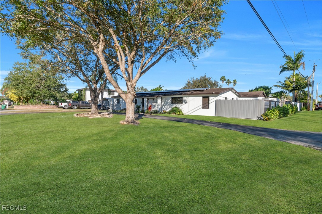 17255 Southwest 299th Street Homestead, FL 33030 - Photo 7 of 47 a view of an house with backyard space and tree