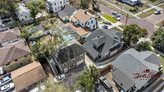 an aerial view of a house with a yard