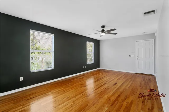 a view of an empty room with a window