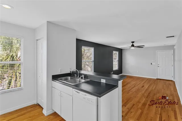 a kitchen with a sink and cabinets
