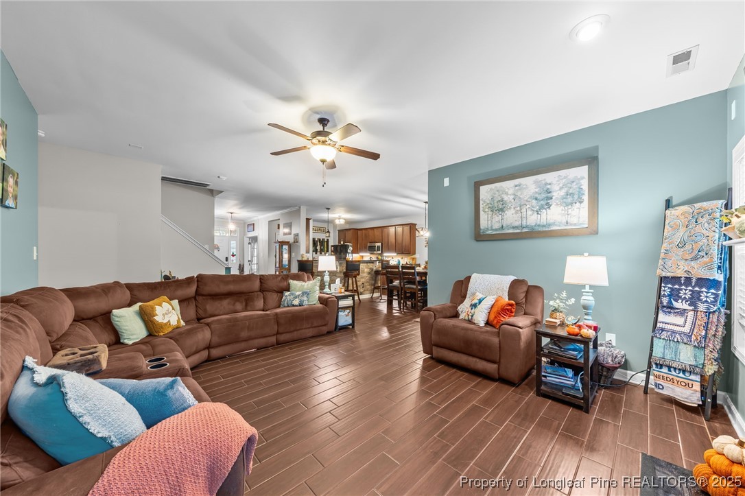 667 St Johns Loop Raeford, NC 28376 - Photo 20 of 50 a living room with furniture and wooden floor