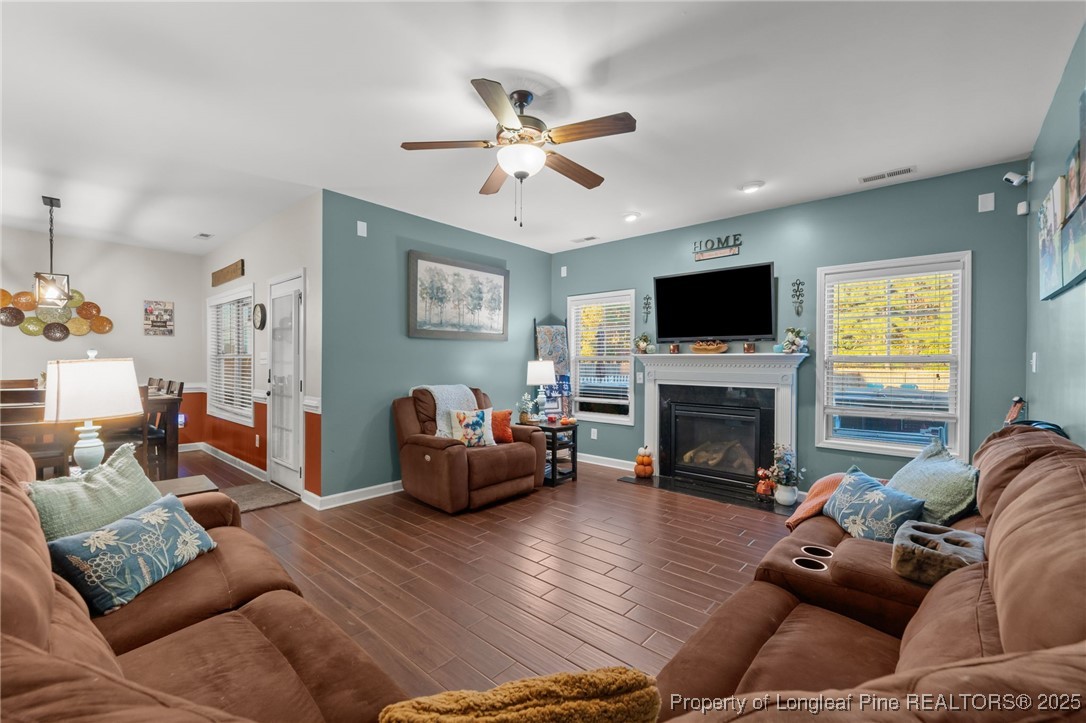 667 St Johns Loop Raeford, NC 28376 - Photo 21 of 50 a living room with furniture and a fireplace