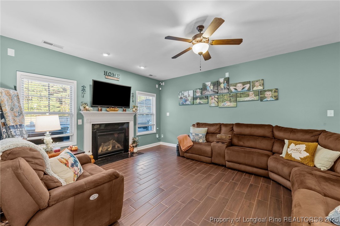 667 St Johns Loop Raeford, NC 28376 - Photo 22 of 50 a living room with furniture flat screen tv and a fireplace