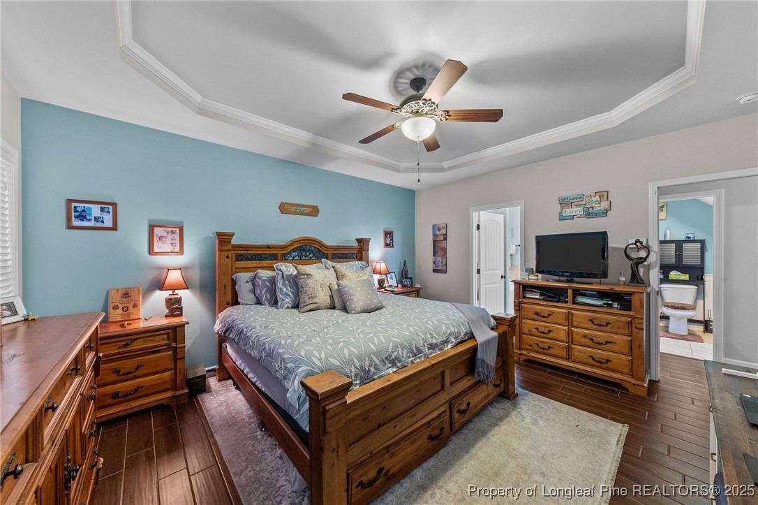 667 St Johns Loop Raeford, NC 28376 - Photo 25 of 50 a bedroom with a bed and a flat screen tv
