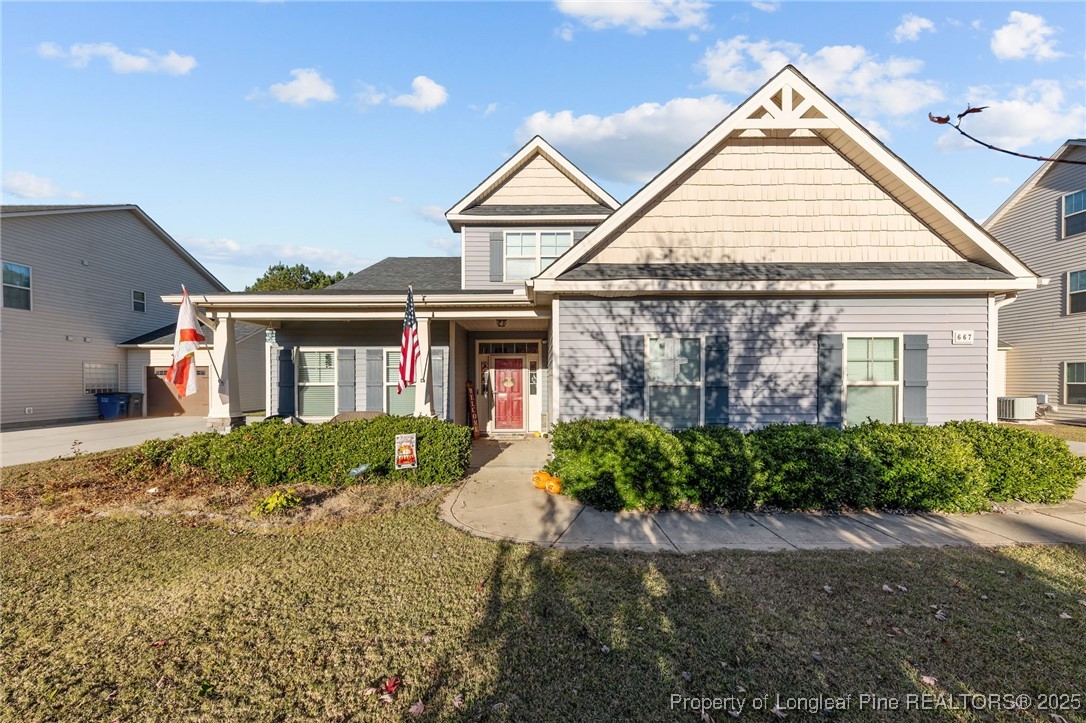 667 St Johns Loop Raeford, NC 28376 - Photo 3 of 50 a view of a white house next to a yard