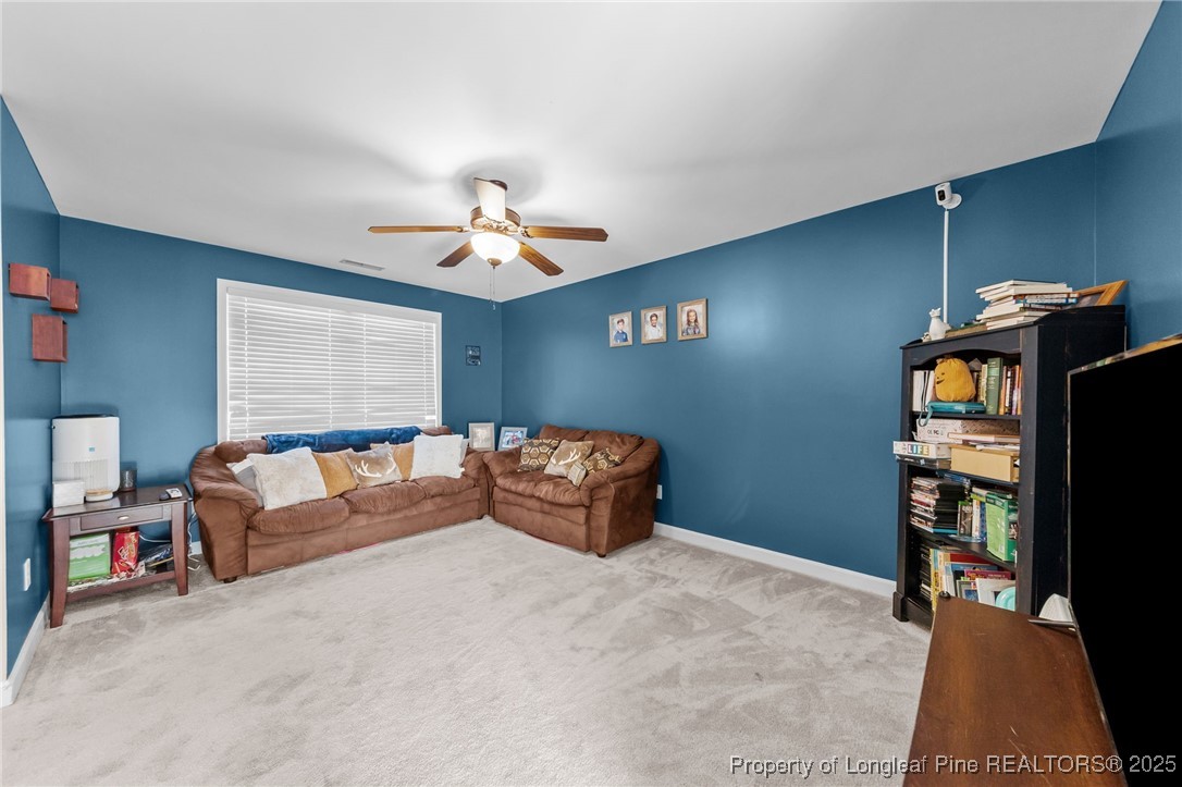 667 St Johns Loop Raeford, NC 28376 - Photo 35 of 50 a living room with furniture and a flat screen tv