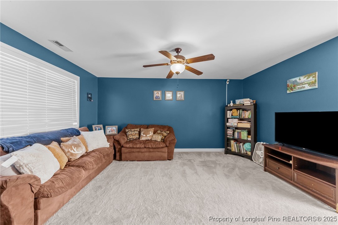 667 St Johns Loop Raeford, NC 28376 - Photo 39 of 50 a bedroom with furniture and a flat screen tv