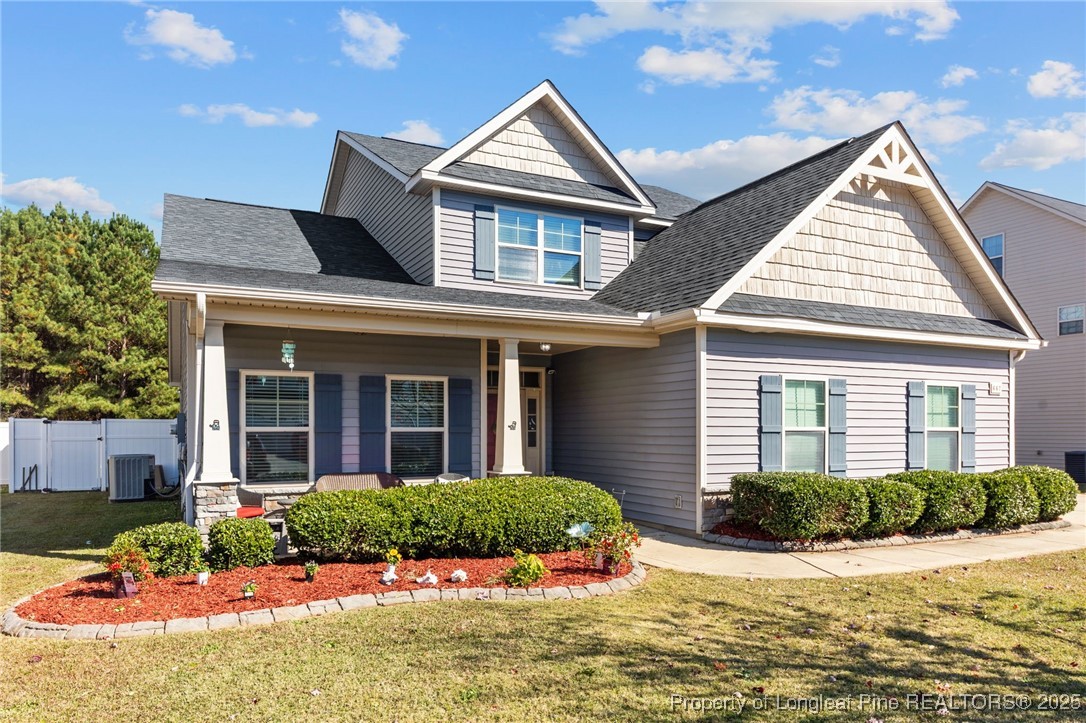 667 St Johns Loop Raeford, NC 28376 - Photo 4 of 50 a front view of a house with a yard