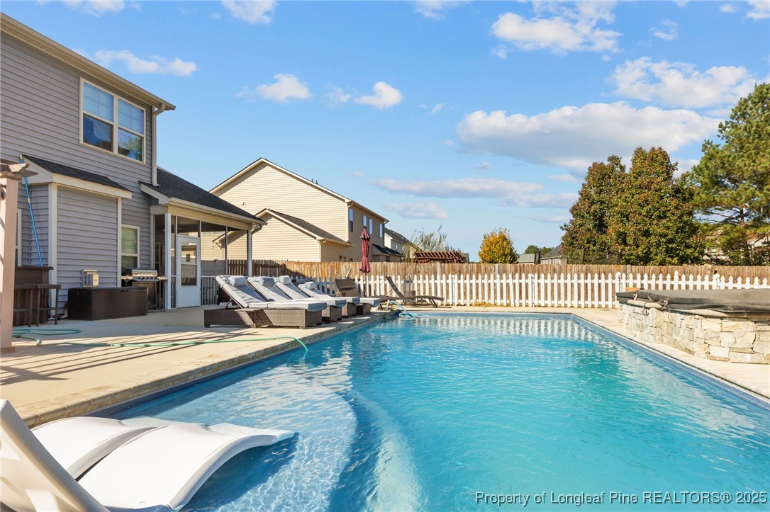 667 St Johns Loop Raeford, NC 28376 - Photo 44 of 50 a view of a house with swimming pool