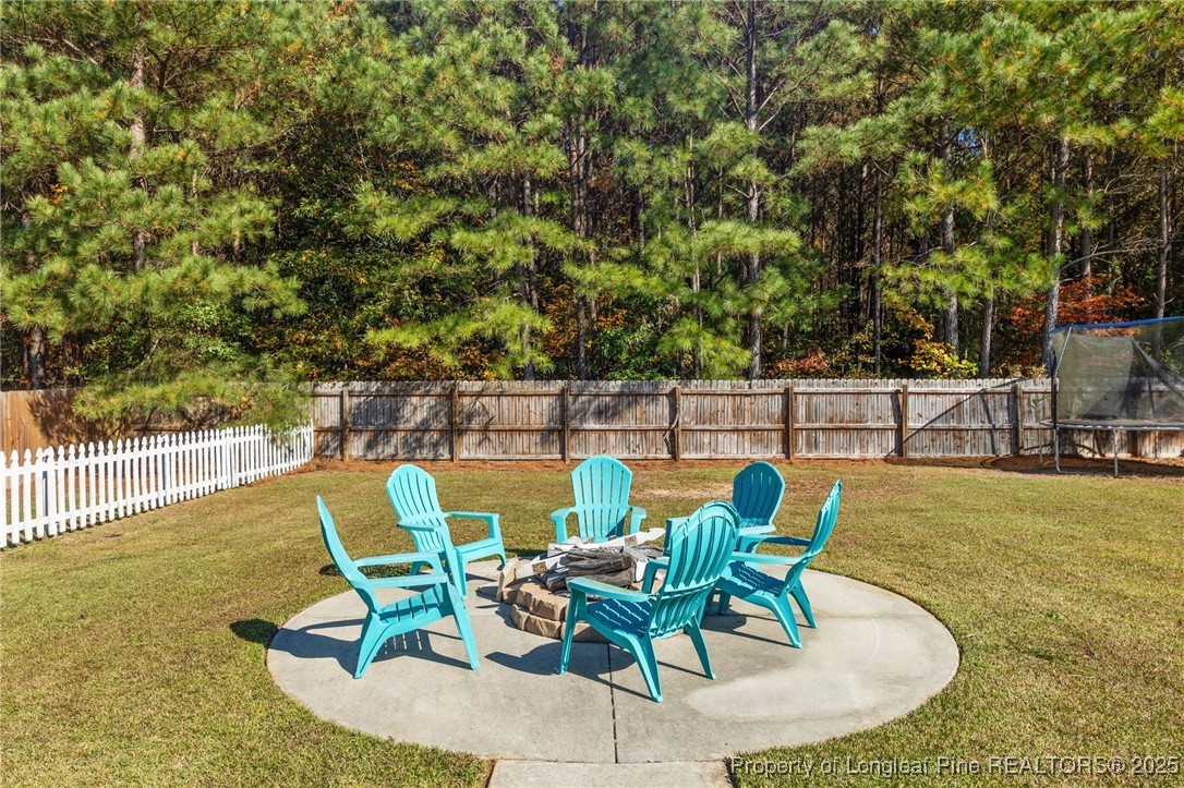667 St Johns Loop Raeford, NC 28376 - Photo 48 of 50 a view of a swimming pool with a lounge chair
