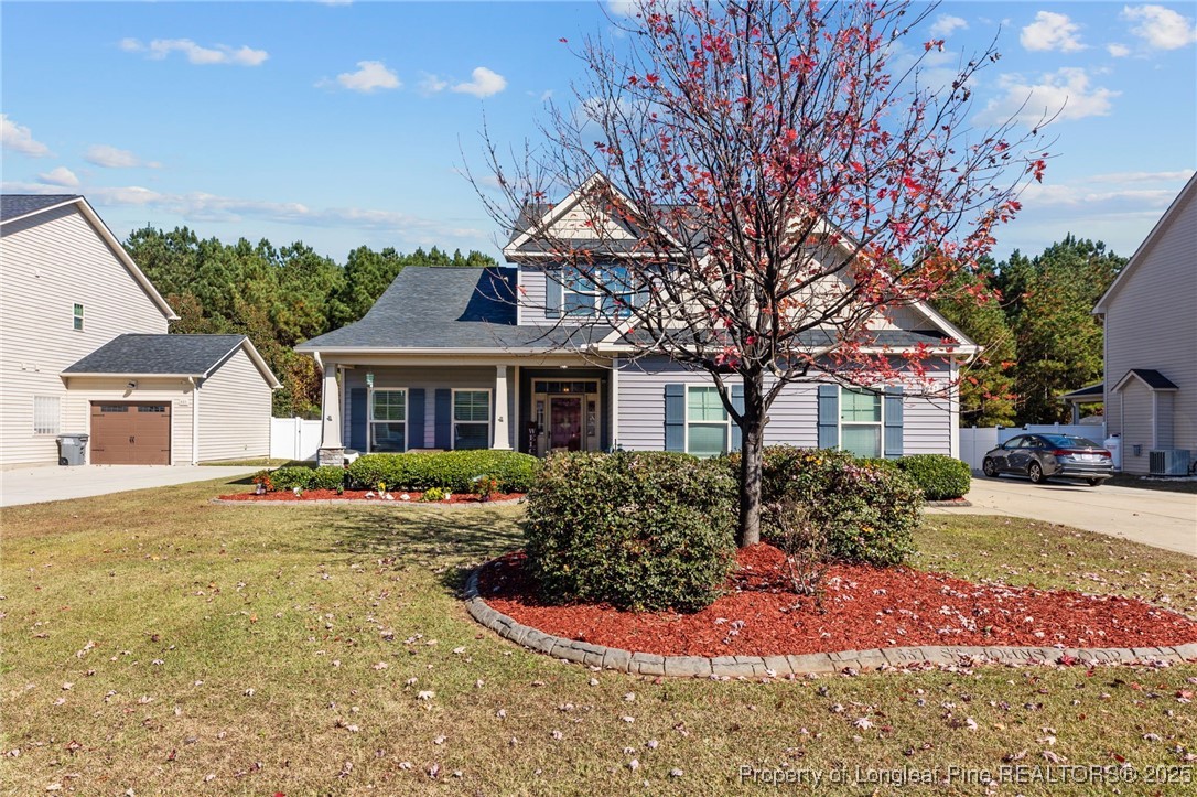 667 St Johns Loop Raeford, NC 28376 - Photo 7 of 50 a front view of a house with garden