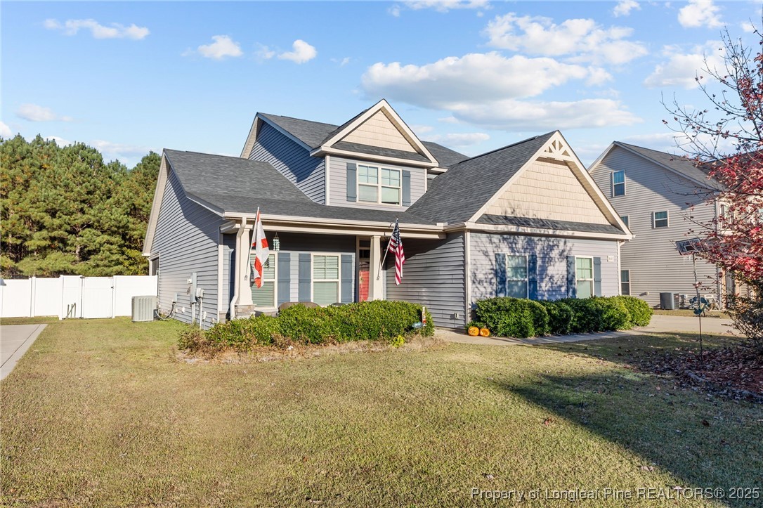 667 St Johns Loop Raeford, NC 28376 - Photo 8 of 50 a front view of a house with a garden