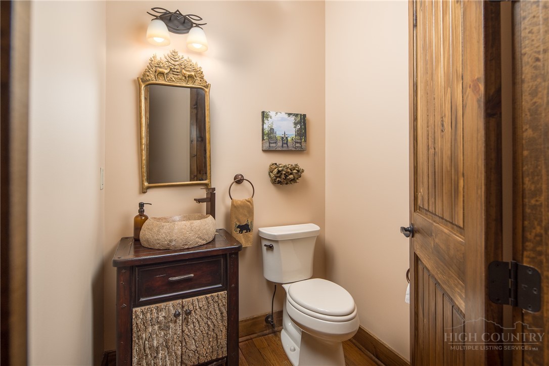 115 Passionflower Trail Boone, NC 28607 - Photo 17 of 50 a bathroom with a toilet and a sink