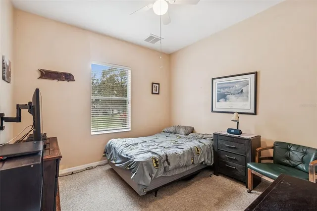 a bathroom with a sink mirror vanity and toilet
