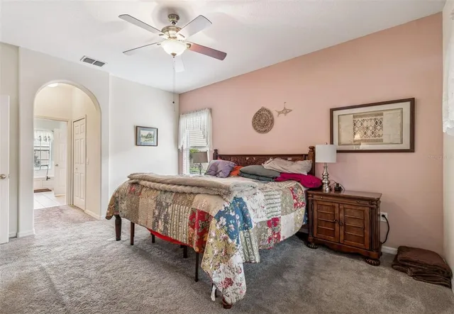 a spacious bathroom with a double vanity sink and a window