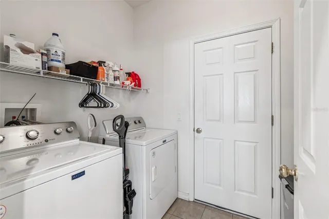 a view of an outdoor sitting area with furniture and backyard