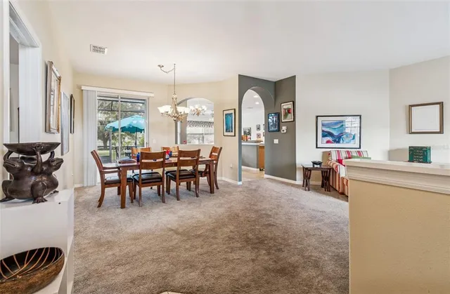a view of a a dining room with furniture window and outside view