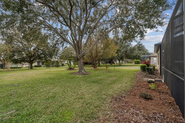 an aerial view of a house with a garden