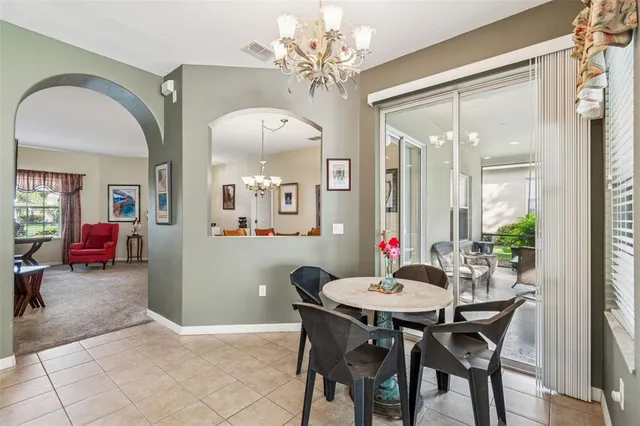 a kitchen with refrigerator and cabinets