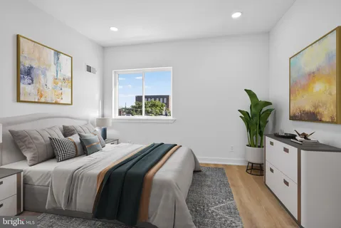 a bedroom with bed and window