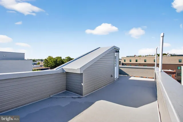 a view of a balcony with two chairs