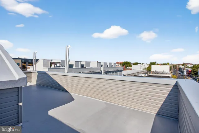 a view of a swimming pool with furniture