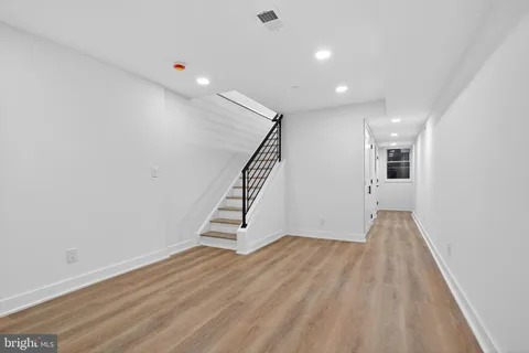 a view of entryway with wooden floor