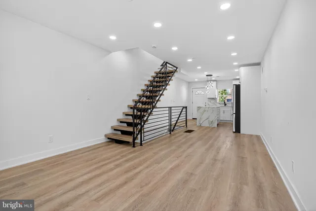 a view of entryway with stairs and wooden floor