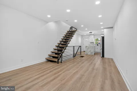 a view of entryway with stairs and wooden floor