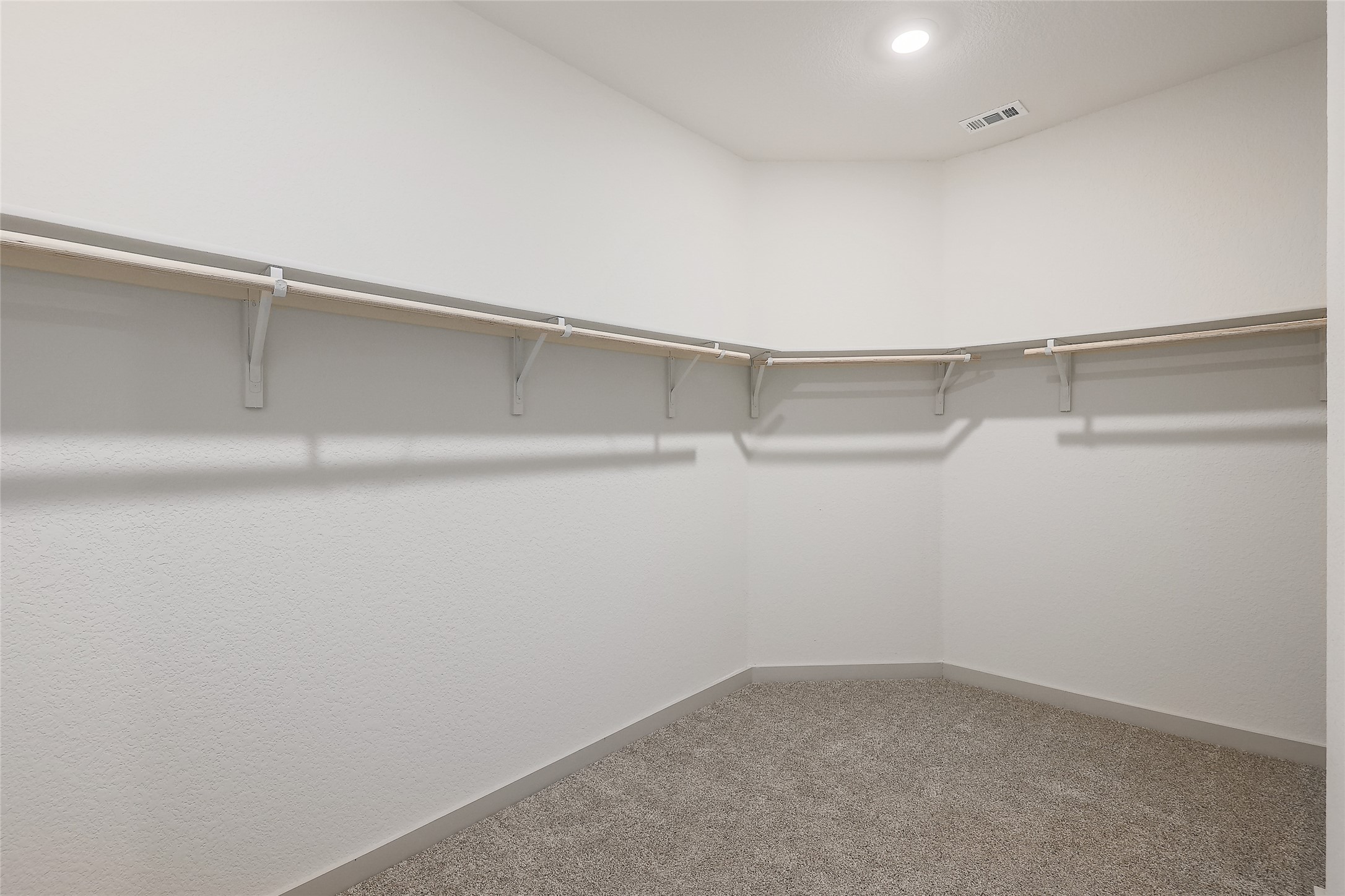 1917 Centerline Lane Georgetown, TX 78628 - Photo 7 of 29 A spacious walk-in closet with ample hanging space and neutral carpeting awaits your wardrobe.