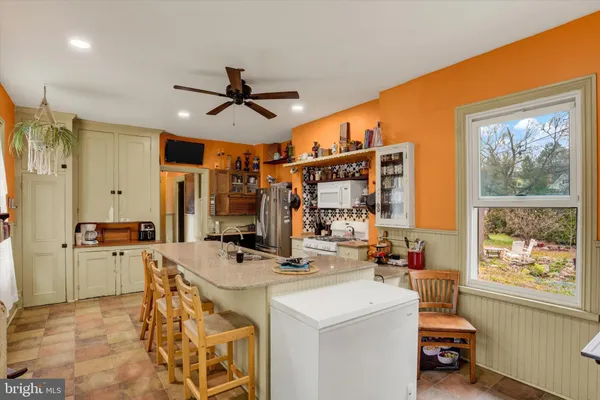 a very nice looking dining room with a large window