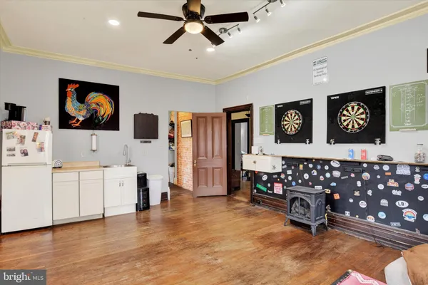 a living room with furniture and painting on the wall