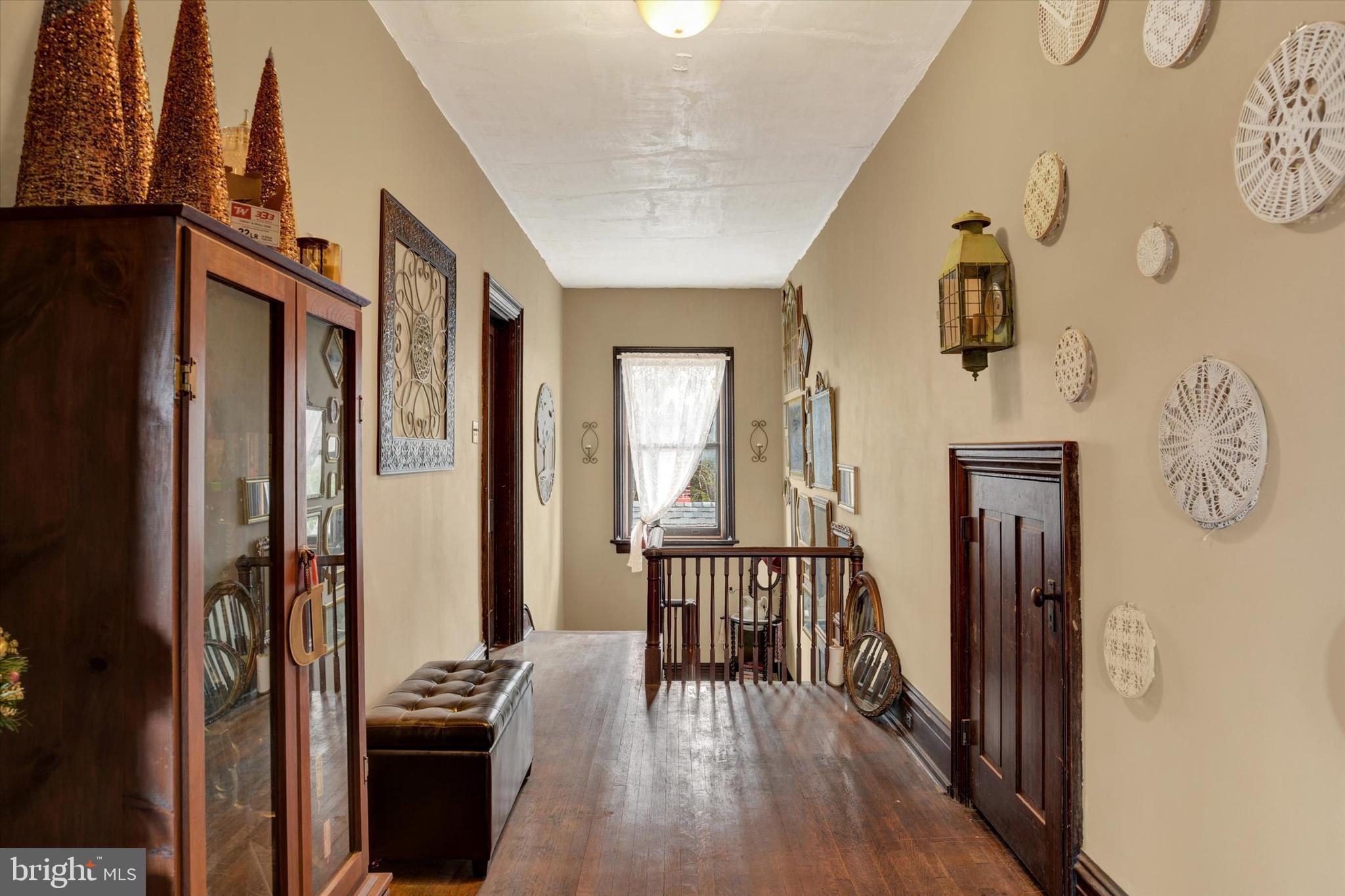 2101 Bellevue Road Harrisburg, PA 17104 - Photo 33 of 49 a view of a hallway with wooden floor and a livingroom