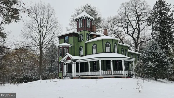 a front view of a house with yard