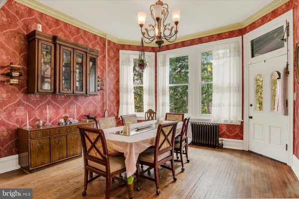 a view of a dining room with furniture and window
