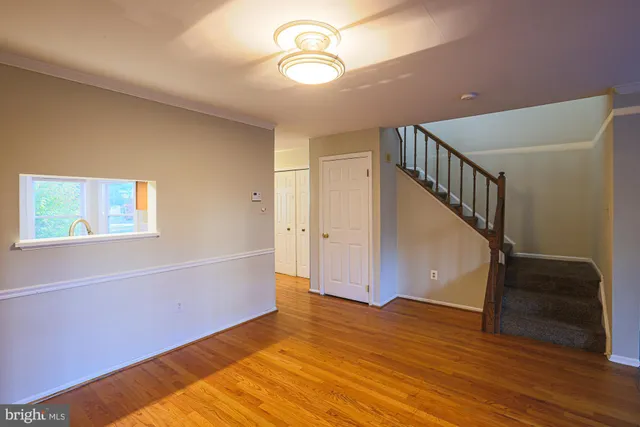 a view of entryway with wooden floor