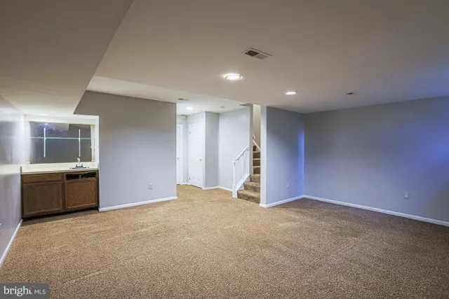 a view of a storage & utility room with two washing machine