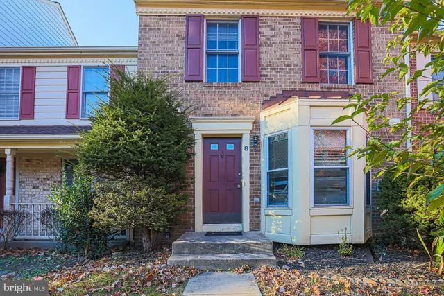 a view of a brick building with many windows