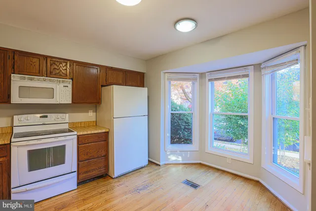 a kitchen with a stove oven and sink