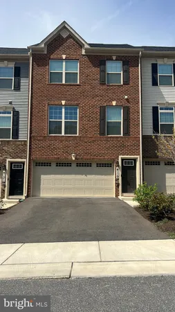 a front view of a house with yard