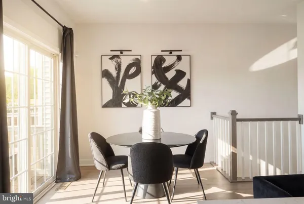 a dining room with furniture and window