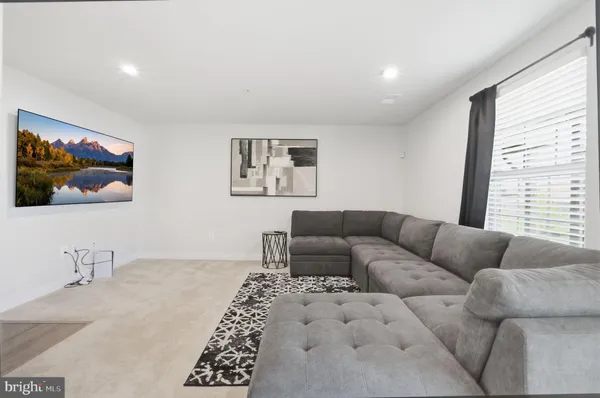 a living room with furniture and a couch