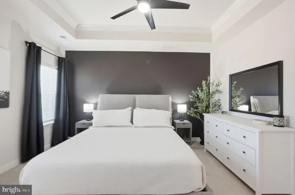 a bedroom with a bed and a desk