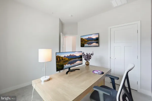 a workspace with furniture and window