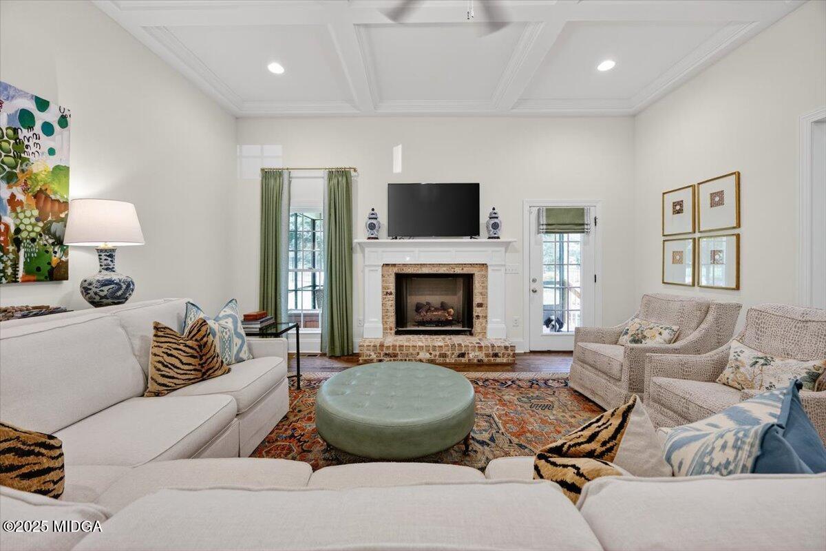 178 Broadleaf Drive Macon, GA 31210 - Photo 6 of 45 a living room with furniture a flat screen tv and a fireplace