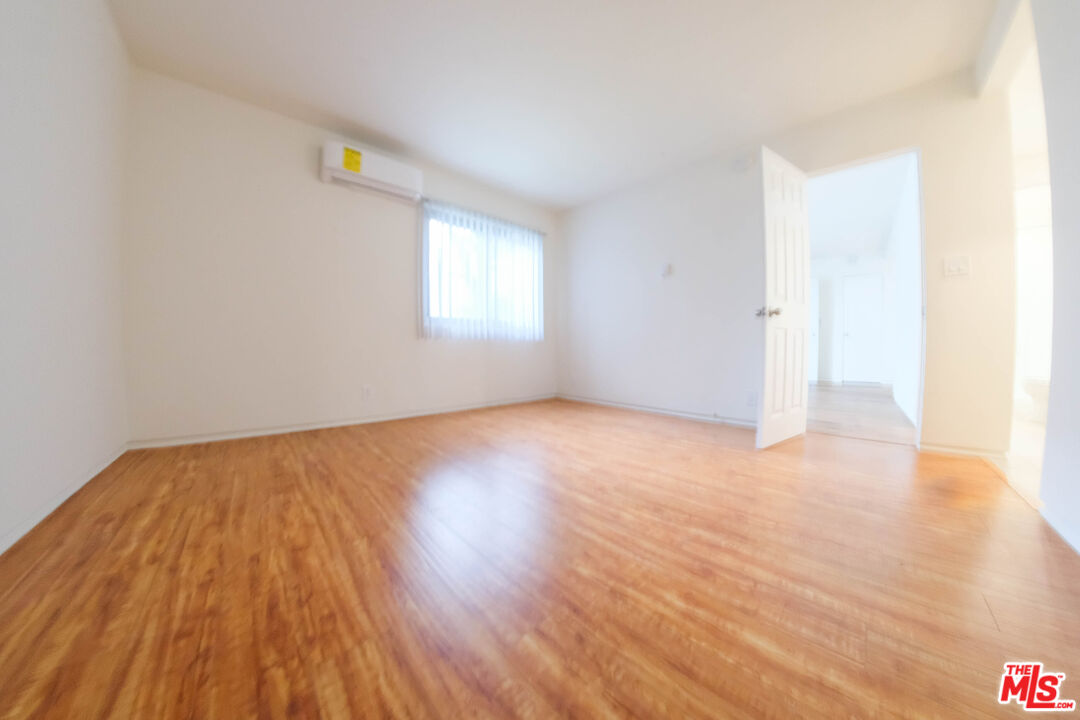 7758 West 91st Street, Unit 2 Playa del Rey, CA 90293 - Photo 15 of 24 a view of empty room with wooden floor and fan