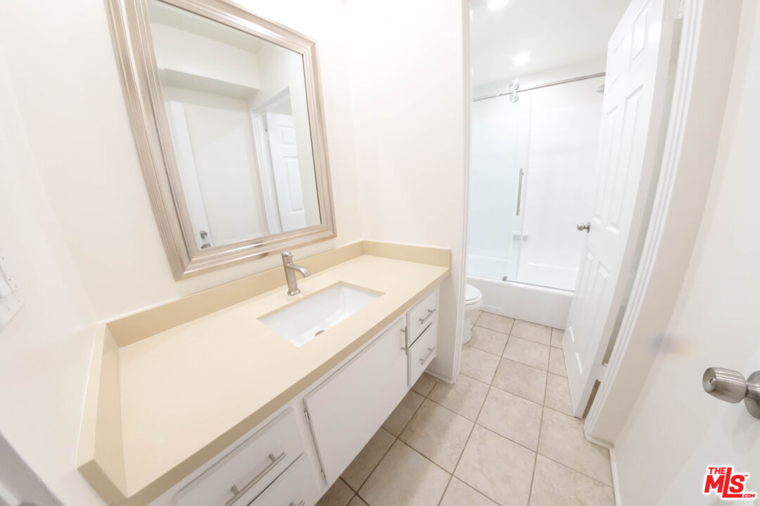 7758 West 91st Street, Unit 2 Playa del Rey, CA 90293 - Photo 17 of 24 a bathroom with a sink a mirror and a bathtub