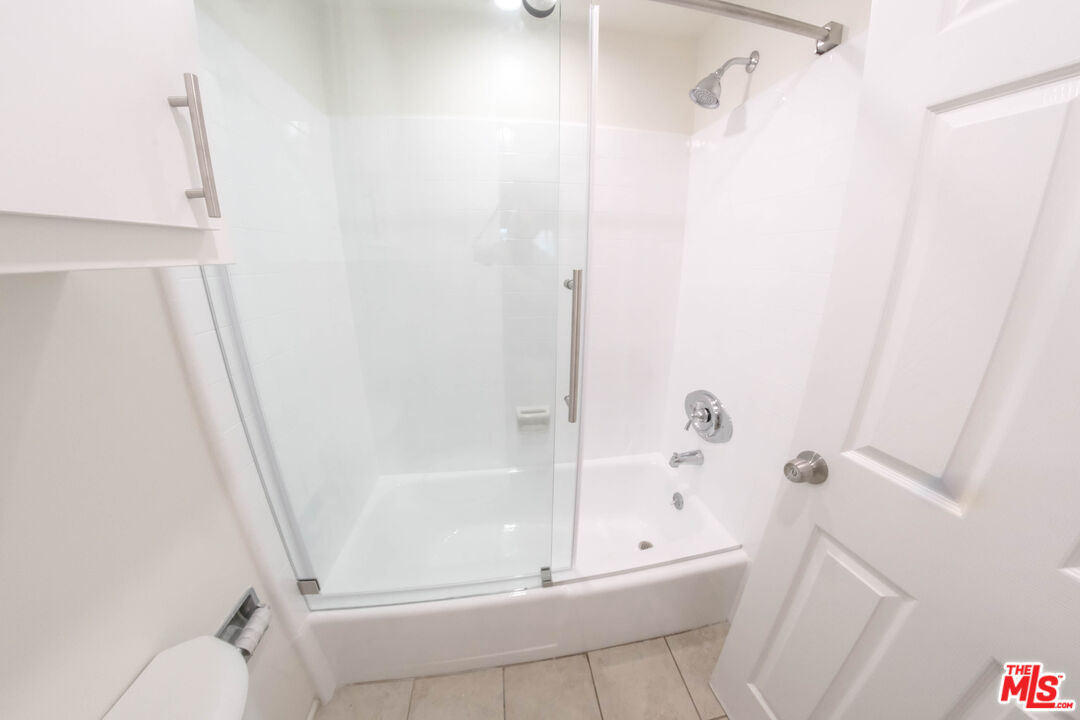 7758 West 91st Street, Unit 2 Playa del Rey, CA 90293 - Photo 18 of 24 a bathroom with a tub and a shower